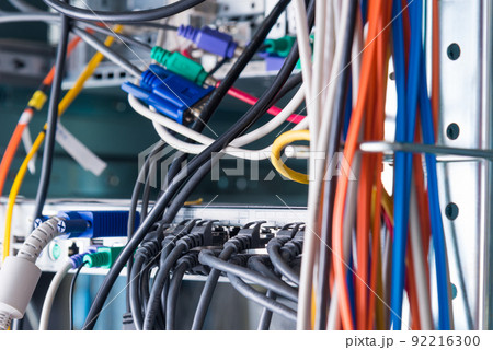 Detail of server room with bunch of fiber optic cables Detail of server room with bunch of fiber optic cables 92216300