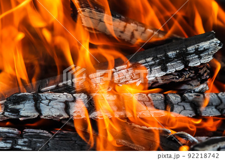 Flames of fire and hot coals of burned wood. Space for copy, text, your words. 92218742