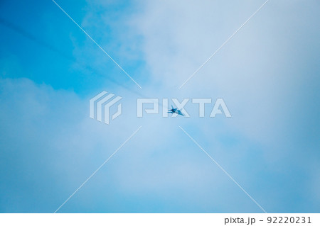 Airplane flying in cloudy sky Airplane flying in cloudy sky 92220231