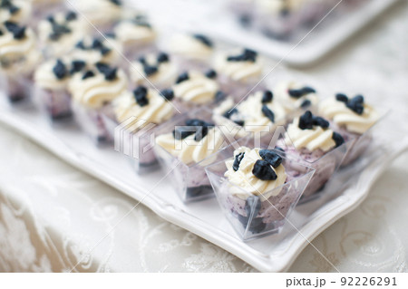 Table with loads of cakes and cupcakes in boxes Table with loads of cakes and cupcakes in boxes 92226291