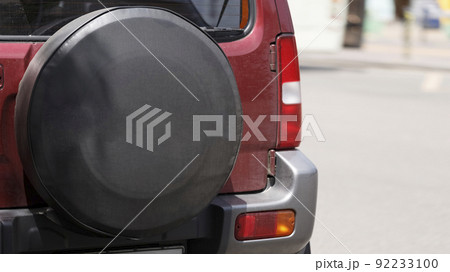 Spare wheel of a car in a case close-up Spare wheel of a car in a case close-up 92233100
