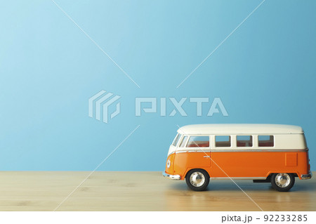 Car travel concept background. Toy retro car on an empty blue background. 92233285