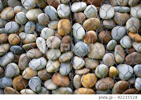 Mineral background behind a fence Mineral background behind a fence 92235528