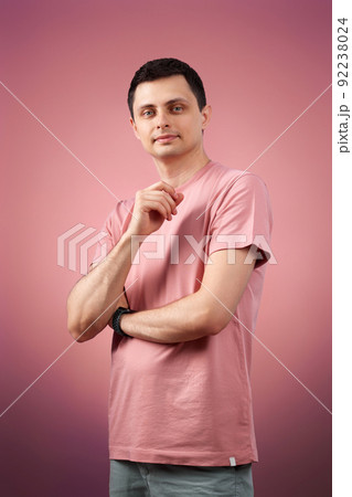 handsome man in t-shirt looking at the camera handsome man in t-shirt looking at the camera 92238024