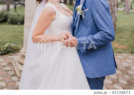 groom with bride together autumn park at wedding 92238673