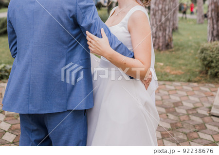 groom with bride together autumn park at wedding 92238676