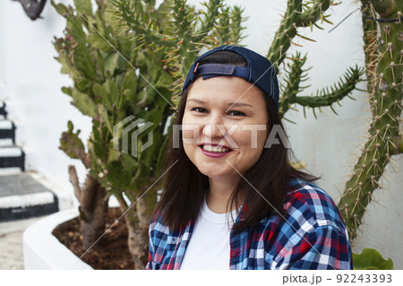 yound pretty american woman siting smiling among cactuses, lifestyle people concept close up yound pretty american woman siting smiling among cactuses, lifestyle people concept close up 92243393