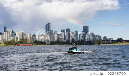 Adventurous Caucasian Woman on Water Scooter riding in the Ocean. 92243799