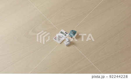 平面上に置かれた指輪とミニチュアのチャペル、電卓の3Dレンダリングイラスト 平面上に置かれた指輪とミニチュアのチャペル、電卓の3Dレンダリングイラスト 92244228