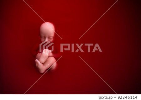 Abortion concept. Baby doll in the red blood looks like abortation. 92246114
