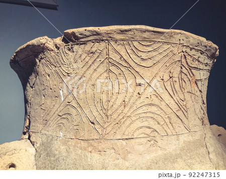 texture. ancient vase with damage. vase made of clay with a pattern, thin lines and ornaments. worn texture, background texture. ancient vase with damage. vase made of clay with a pattern, thin lines and ornaments. worn texture, background 92247315