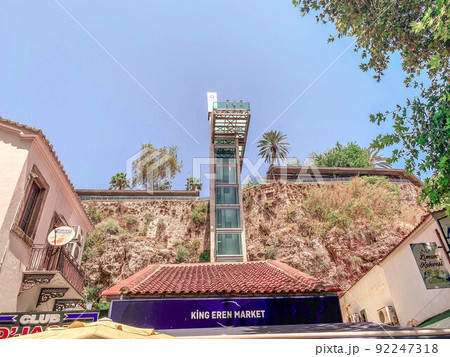 a tall building in a hot, tropical country. for tourists there is an elevator with panoramic windows. lift to the upper floors. sightseeing tour 92247318