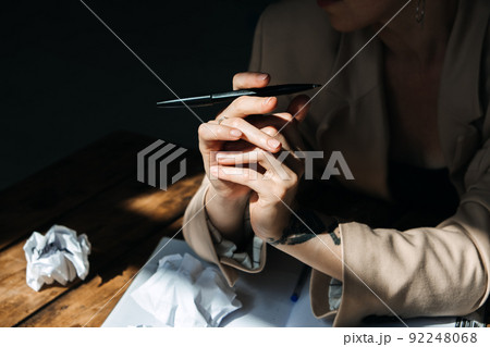 Woman writer, professional content working with papers on table at home. 92248068