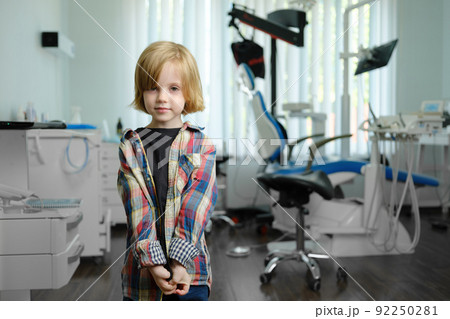 Portrait of cute boy in dental cabinet 92250281