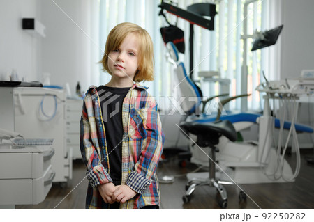 Portrait of cute boy in dental cabinet Portrait of cute boy in dental cabinet 92250282