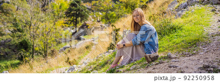 BANNER, LONG FORMAT Woman tourist enjoys the view of Kotor. Montenegro. Bay of Kotor, Gulf of Kotor, Boka Kotorska and walled old city. Travel to Montenegro concept. Fortifications of Kotor is on BANNER, LONG FORMAT Woman tourist enjoys the view of Kotor. Montenegro. Bay of Kotor, Gulf of Kotor, Boka Kotorska and walled old city. Travel to Montenegro concept. Fortifications of Kotor is on 92250958