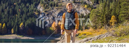 BANNER, LONG FORMAT Man tourist in background of Panoramic morning view of Black Lake Crno Jezero. Calm summer scene of Durmitor Nacionalni Park, Zabljak location, Montenegro, Europe. Beauty of nature BANNER, LONG FORMAT Man tourist in background of Panoramic morning view of Black Lake Crno Jezero. Calm summer scene of Durmitor Nacionalni Park, Zabljak location, Montenegro, Europe. Beauty of nature 92251464