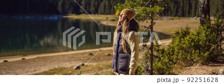 BANNER, LONG FORMAT Woman tourist in background of Panoramic morning view of Black Lake Crno Jezero. Calm summer scene of Durmitor Nacionalni Park, Zabljak location, Montenegro, Europe. Beauty of BANNER, LONG FORMAT Woman tourist in background of Panoramic morning view of Black Lake Crno Jezero. Calm summer scene of Durmitor Nacionalni Park, Zabljak location, Montenegro, Europe. Beauty of 92251628