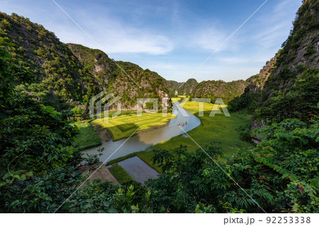 Yellow rice field on Ngo Dong river in Tam Coc Bich Dong from mountain top view in Ninh Binh, Viet Nam 92253338