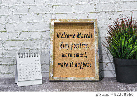 Inspirational and motivational quote on wooden frame and March 2022 calendar. Inspirational and motivational quote on wooden frame and March 2022 calendar. 92259966