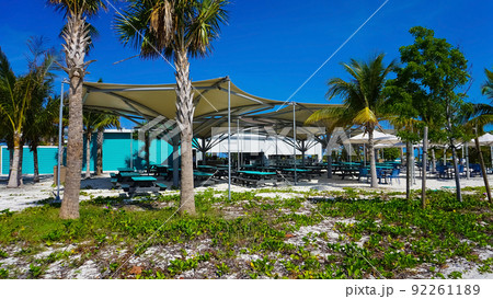 Beach on Ocean Cay Bahamas Island with a colorful houses and turquoise water 92261189