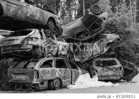 Black and white photo of the war in Ukraine - destroyed cars in Bucha district 92269051