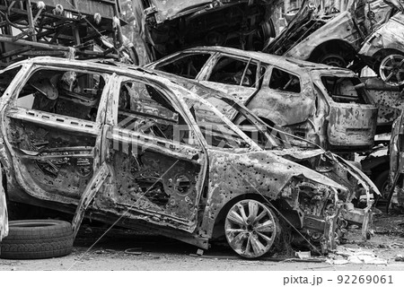 Shot and burned cars during the war in Ukraine, black and white photo Shot and burned cars during the war in Ukraine, black and white photo 92269061