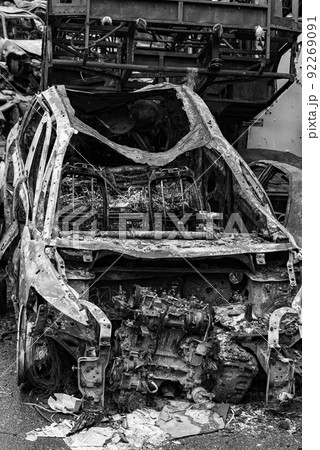 Black and white photo of the war in Ukraine - destroyed cars in Bucha district 92269091