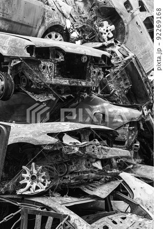 Shot and burned cars during the war in Ukraine, black and white photo Shot and burned cars during the war in Ukraine, black and white photo 92269168