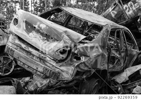 Shot and burned cars during the war in Ukraine, black and white photo Shot and burned cars during the war in Ukraine, black and white photo 92269359