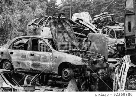 Shot and burned cars during the war in Ukraine, black and white photo Shot and burned cars during the war in Ukraine, black and white photo 92269386