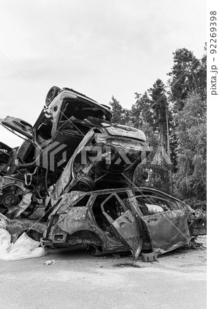 Black and white photo of the war in Ukraine - destroyed cars in Bucha district Black and white photo of the war in Ukraine - destroyed cars in Bucha district 92269398