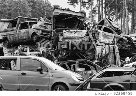 Shot and burned cars during the war in Ukraine, black and white photo 92269459
