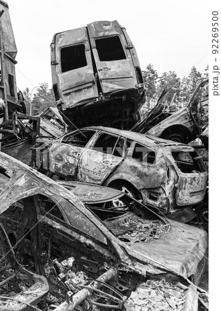 Shot and burned cars during the war in Ukraine, black and white photo 92269500