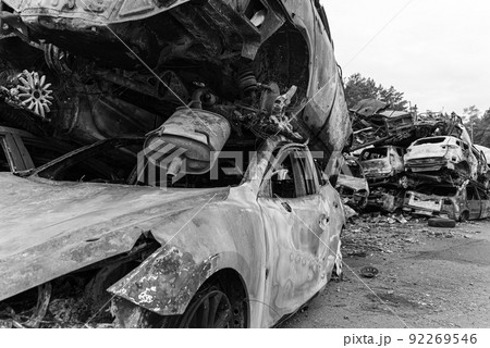 Black and white photo of the war in Ukraine - destroyed cars in Bucha district 92269546