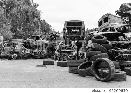 Shot and burned cars during the war in Ukraine, black and white photo 92269650