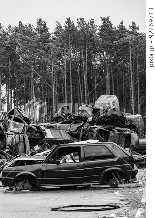 Shot and burned cars during the war in Ukraine, black and white photo Shot and burned cars during the war in Ukraine, black and white photo 92269713