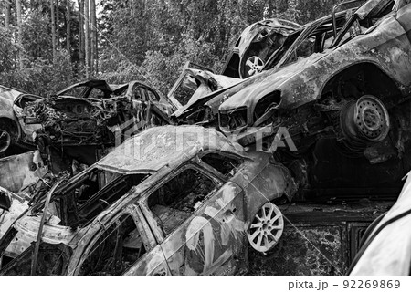 Black and white photo of the war in Ukraine - destroyed cars in Bucha district 92269869