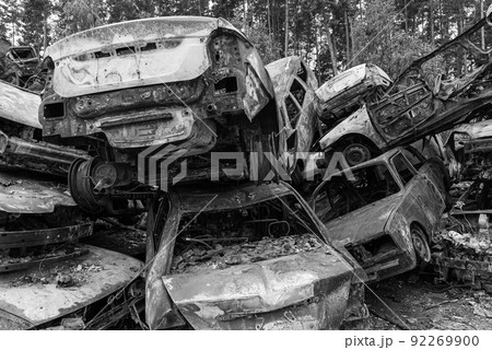 Shot and burned cars during the war in Ukraine, black and white photo 92269900
