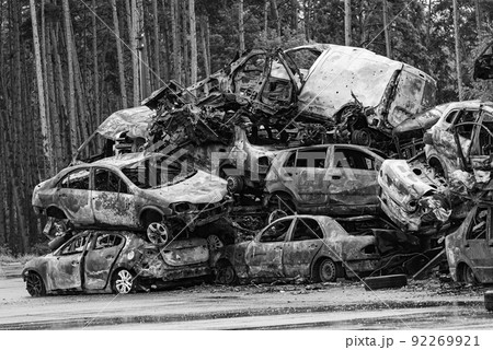 Shot and burned cars during the war in Ukraine, black and white photo Shot and burned cars during the war in Ukraine, black and white photo 92269921