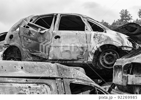 Black and white photo of the war in Ukraine - destroyed cars in Bucha district 92269985