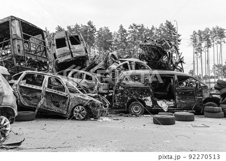 Shot and burned cars during the war in Ukraine, black and white photo Shot and burned cars during the war in Ukraine, black and white photo 92270513