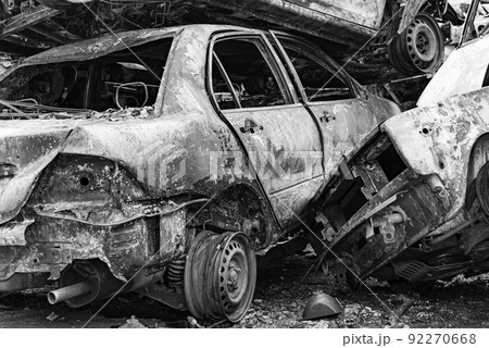 Shot and burned cars during the war in Ukraine, black and white photo Shot and burned cars during the war in Ukraine, black and white photo 92270668
