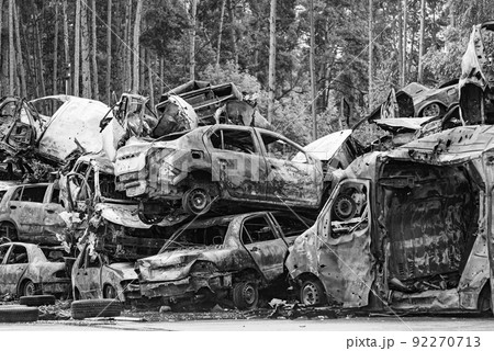 Black and white photo of the war in Ukraine - destroyed cars in Bucha district 92270713