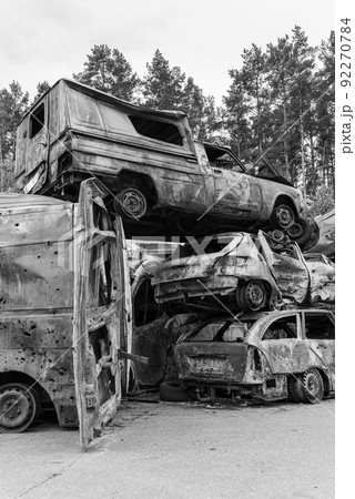 Shot and burned cars during the war in Ukraine, black and white photo Shot and burned cars during the war in Ukraine, black and white photo 92270784
