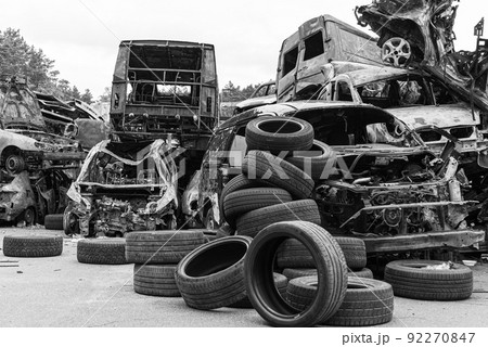Shot and burned cars during the war in Ukraine, black and white photo 92270847