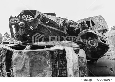 Shot and burned cars during the war in Ukraine, black and white photo 92270897