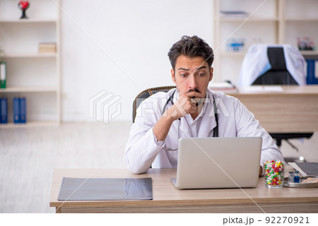 Young male doctor working in the clinic 92270921