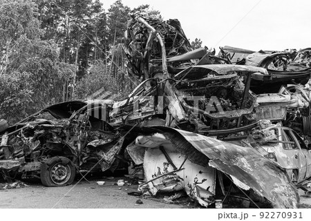 Shot and burned cars during the war in Ukraine, black and white photo Shot and burned cars during the war in Ukraine, black and white photo 92270931