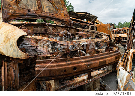 Shot and burned cars during the war in Ukraine Shot and burned cars during the war in Ukraine 92271383